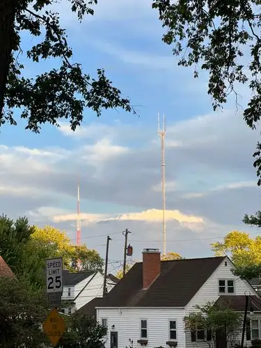 Towers pierce the tranquil evening sky.